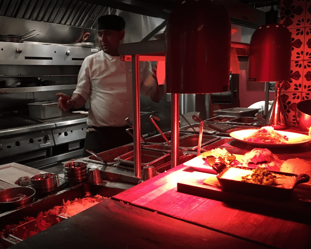 The open kitchen allows the customer to see their meal being crafted from scratch.