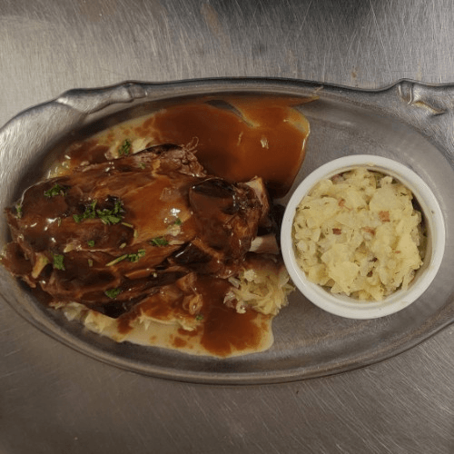 Smoked Pork Shank Over Sauerkraut.
