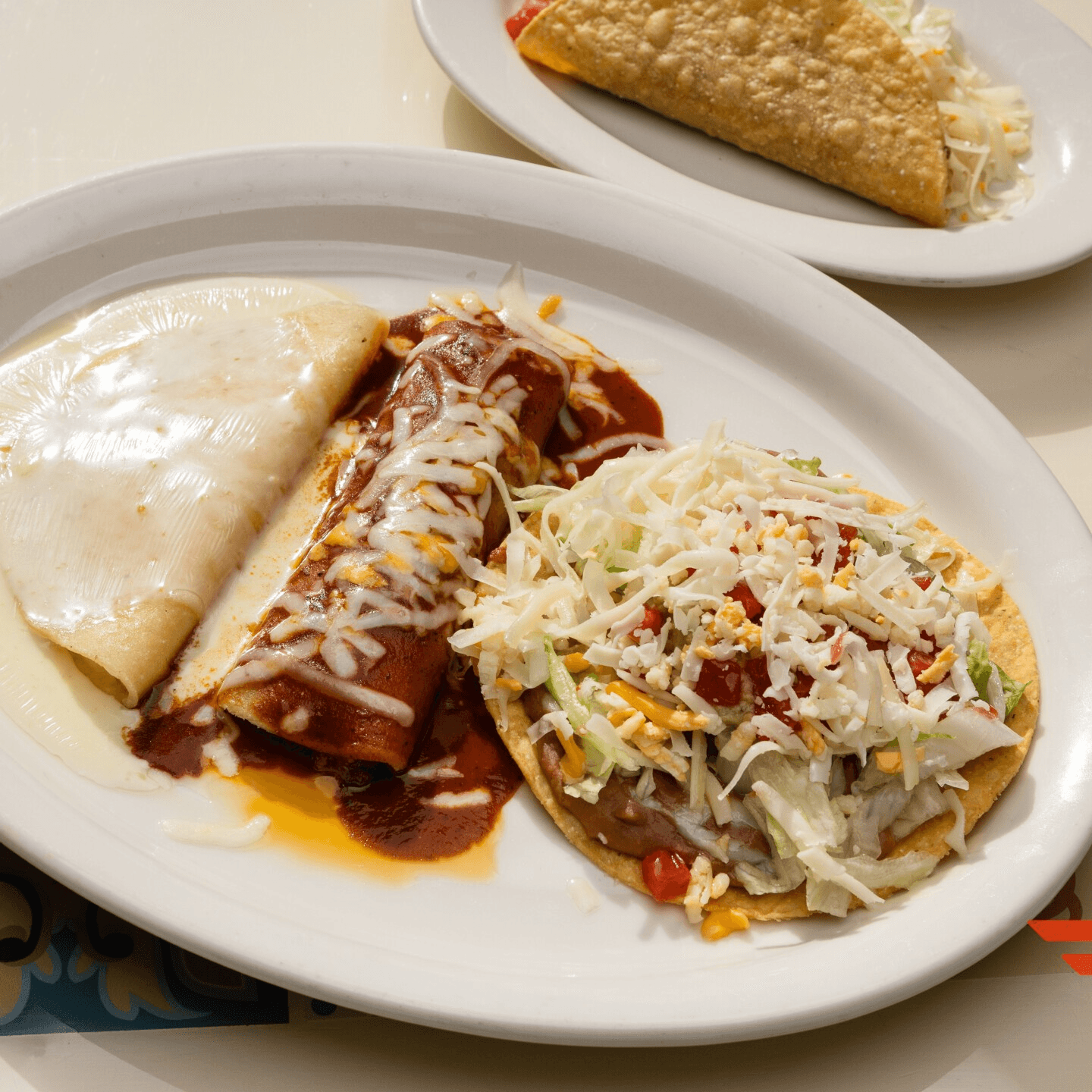 C. Una Chalupa, Un Taco De Queso, Un Taco De Res Y Una Enchilada De Res / C. One Chalupa, One Cheese Taco, One Beef Taco & One Beef Enchilada.