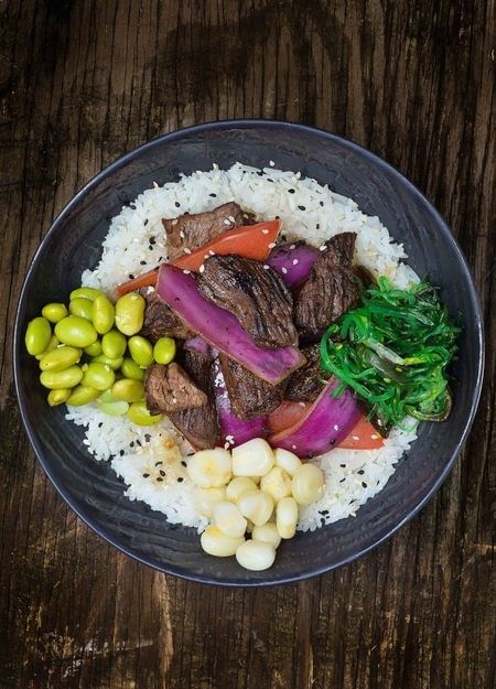 Poke Lomo Saltado with Our Spicy Mayo.