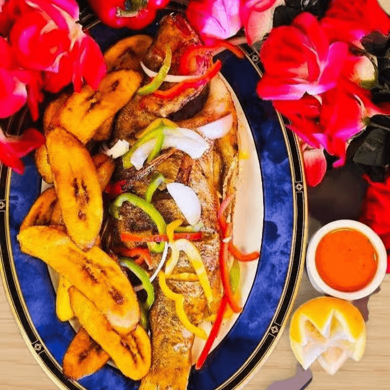 Grilled Red Snapper with Fried Plantains, French Fries or Jallof Rice.