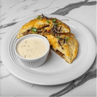 Stuffed Biscuit with Spicy Sausage and Seasoned Potatoes.