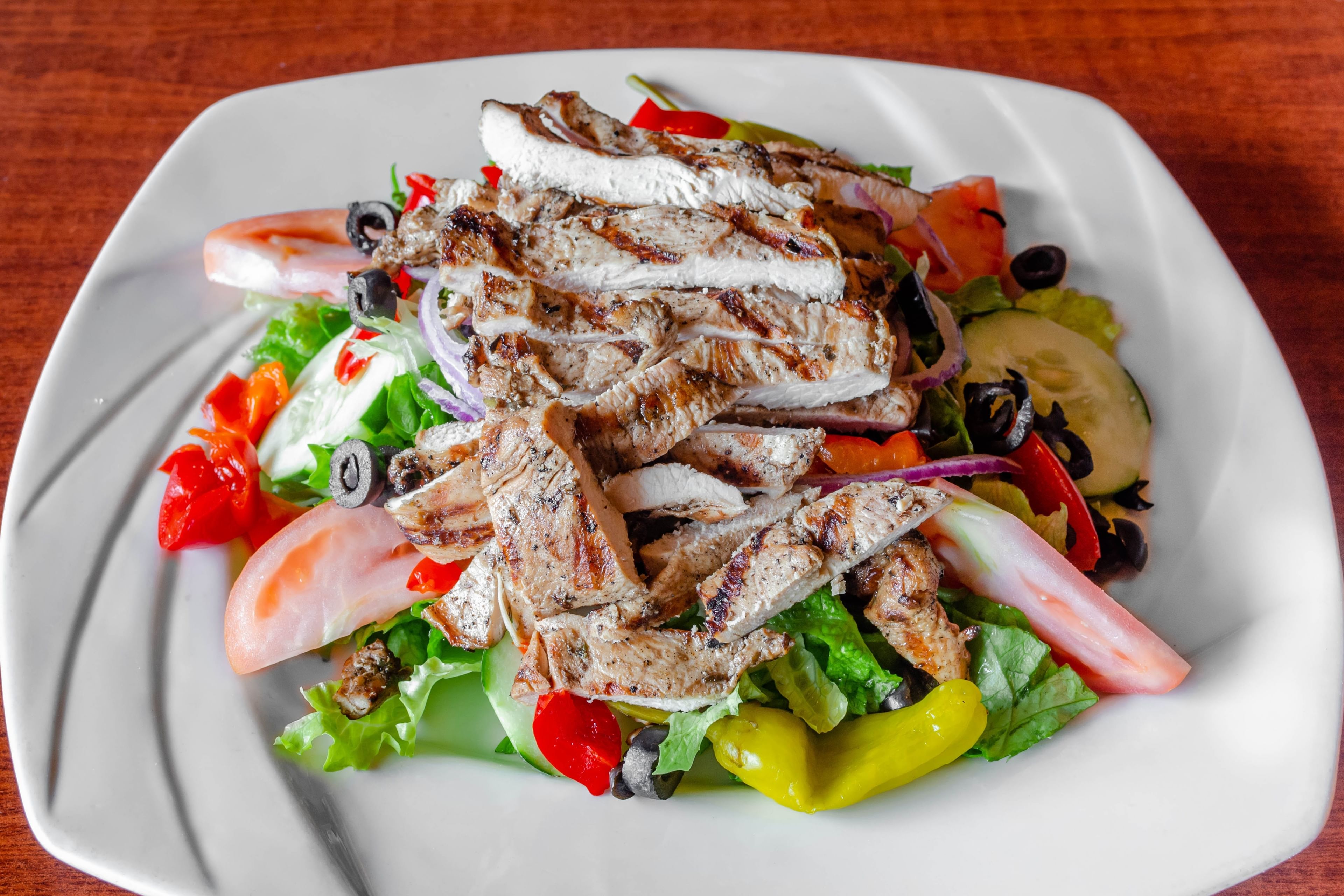 Grilled Chicken Over Tossed Salad.