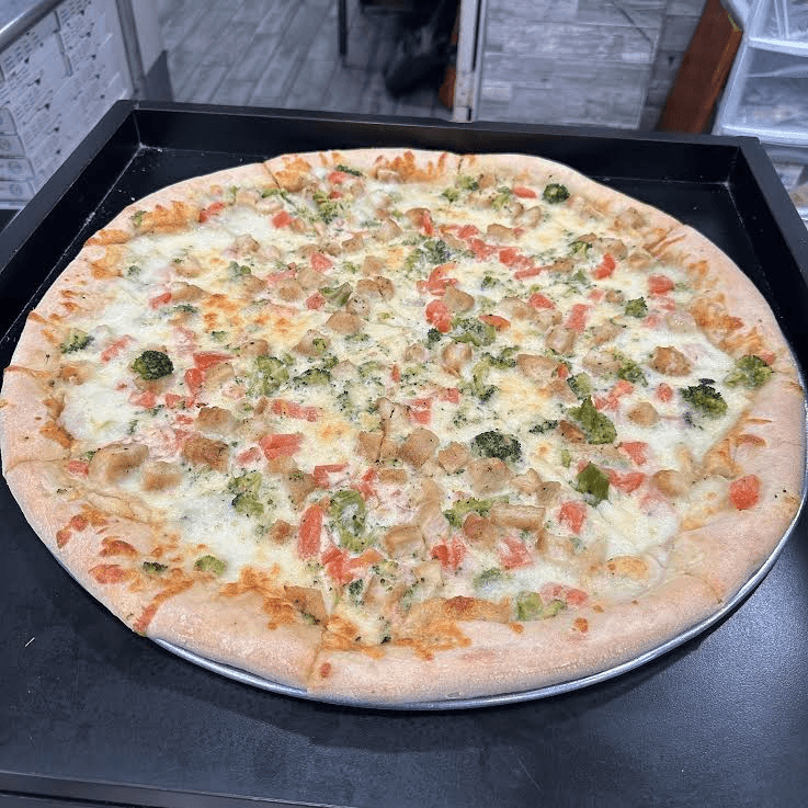 Chicken Alfredo Pizza Slice.