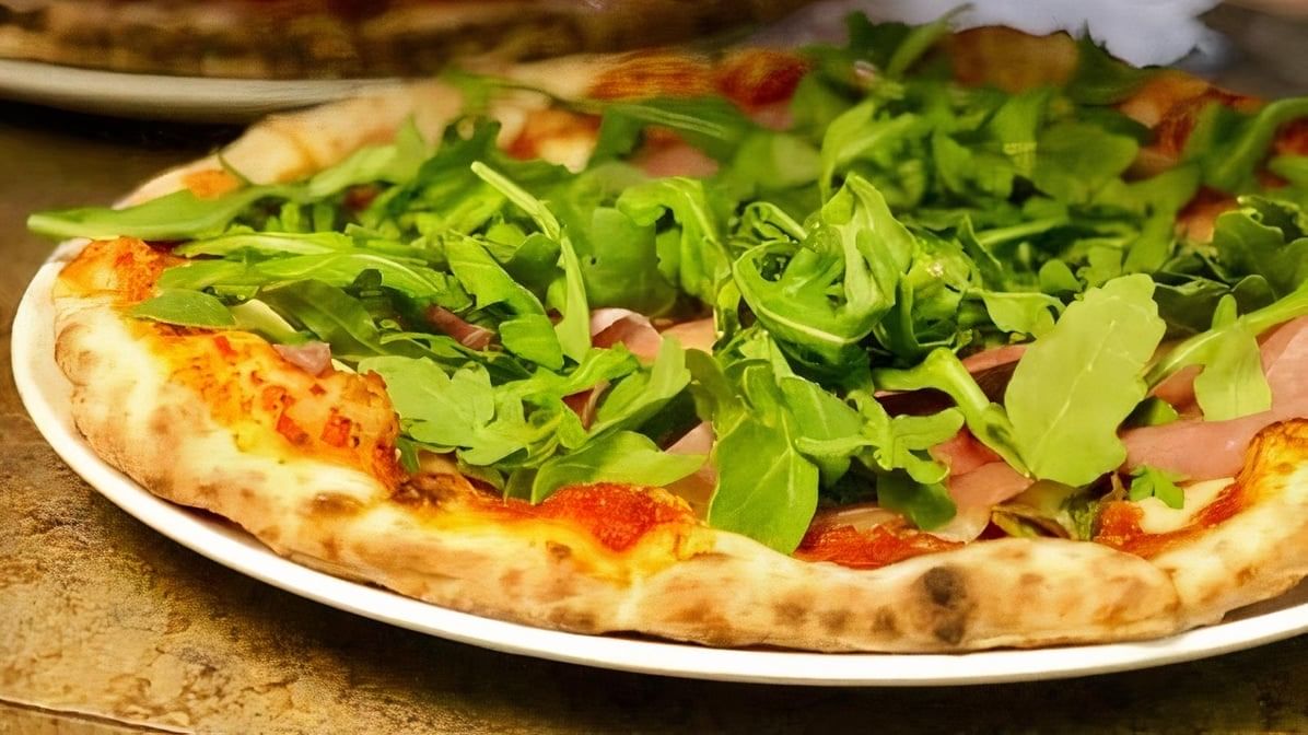 Personal Prosciutto and Arugula Pizza.