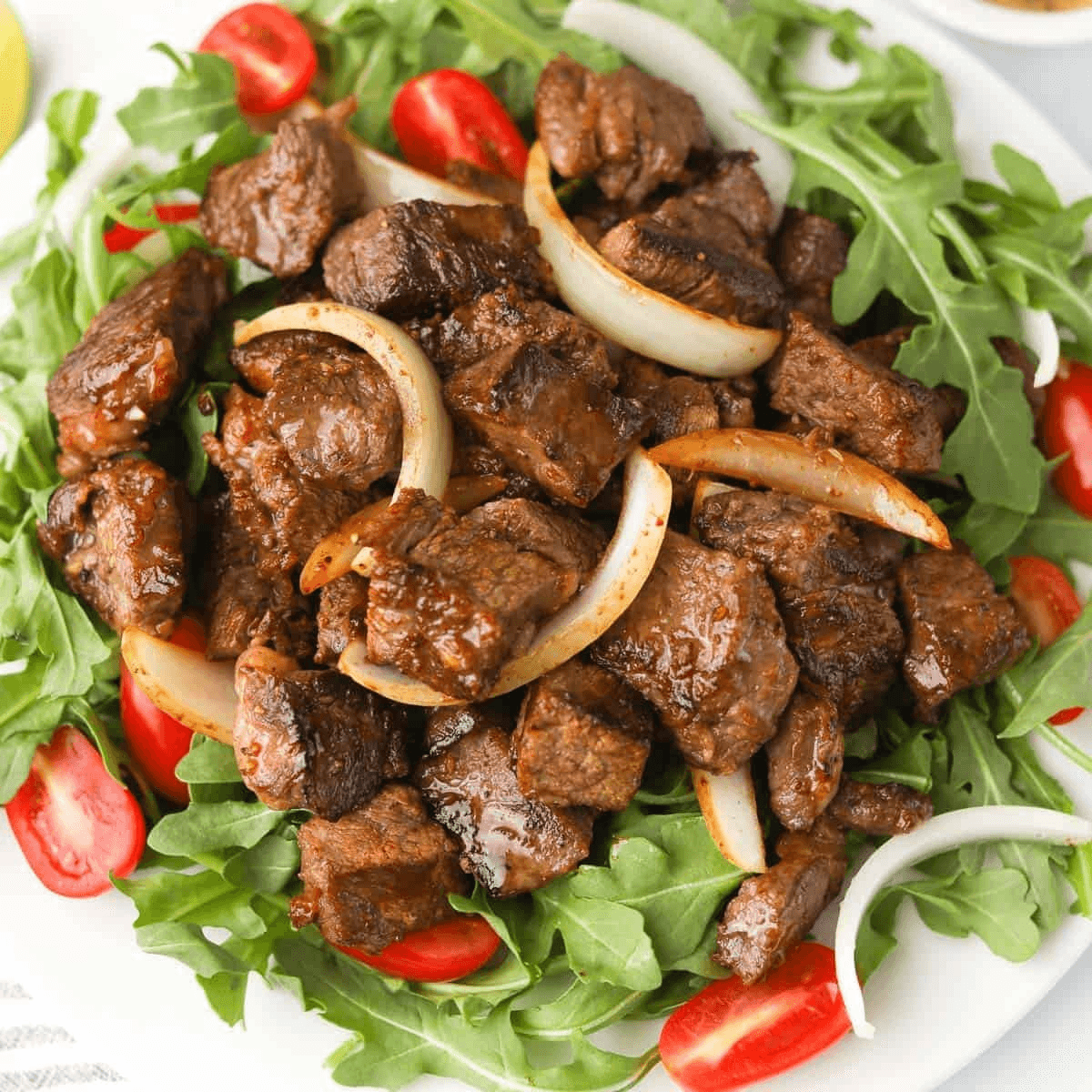 S2. Shaky Beef Over White Rice (Com Bo LLac).