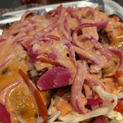 Chuleta Con Tajadas/Pork chops with green bananas.