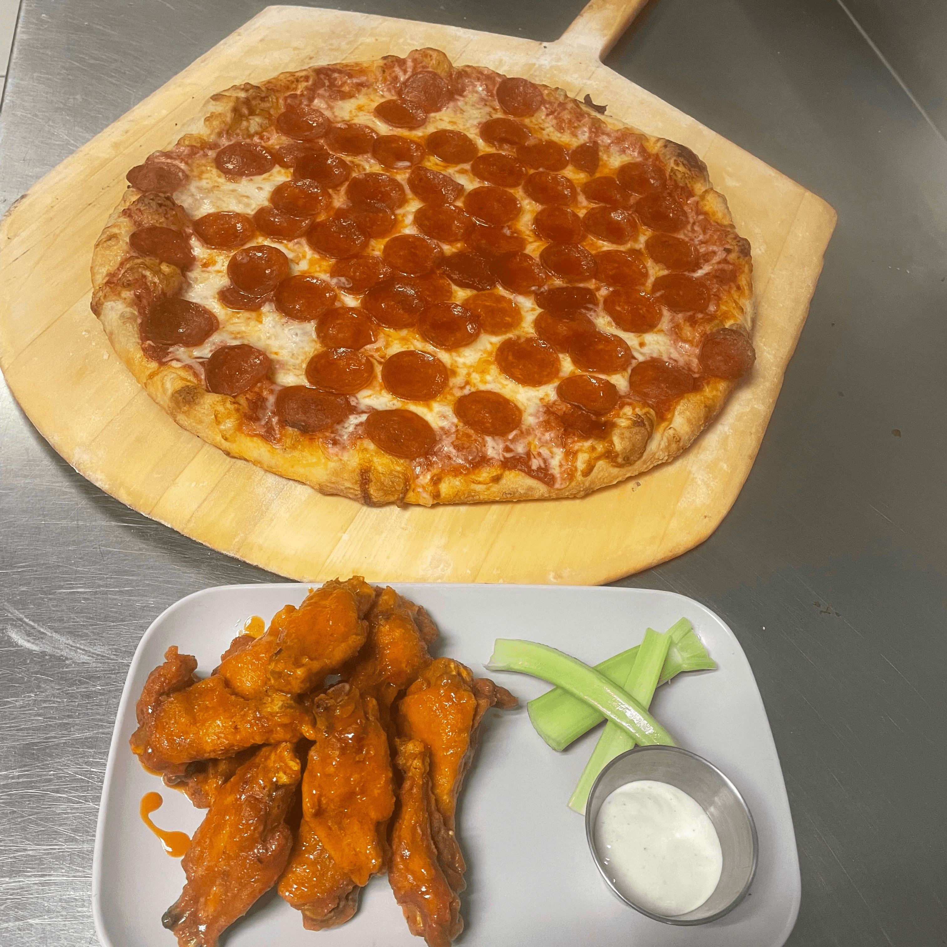 $1 Wings with Large Pizza.