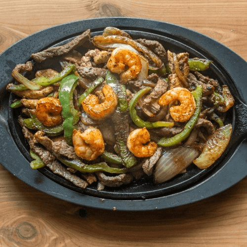 Texas Fajitas Steak, Chicken & Shrimp.
