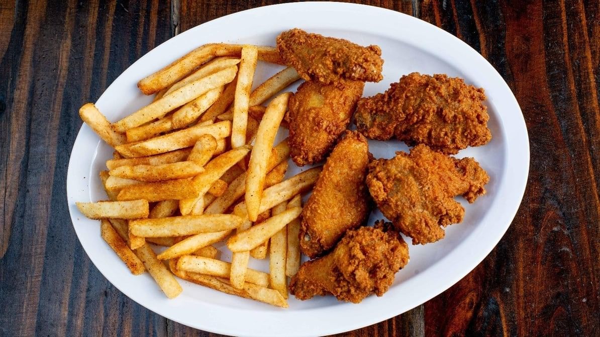 Six Pcs Chicken Wings with Fries.