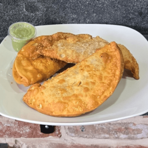 Buy 2 curry goat empanadas and get a 3rd for free!.
