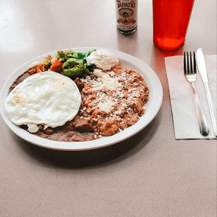 2 Eggs with either Pork Chile Verde or Chile Colorado.