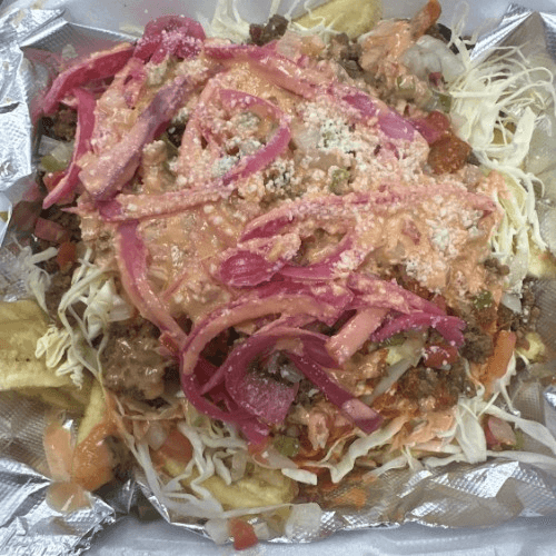 Tajadas De Carne Molida/Ground beef with green bananas.