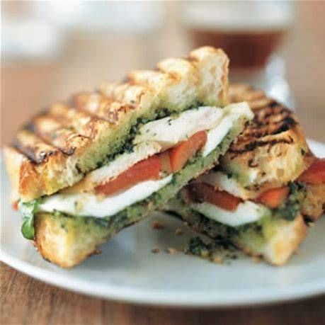 GRILLED CHICKEN PESTO SANDWICH WITH FRIES.