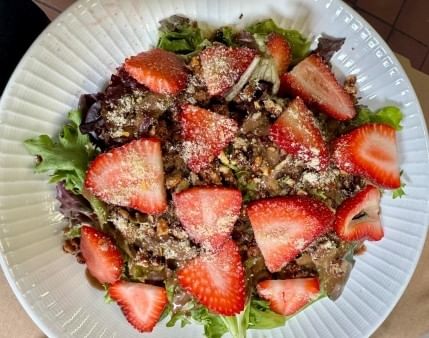 Strawberry salad with candied walnuts.