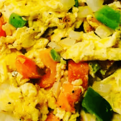 Migas: Eggs, Onion, Tomatoes, Bell Peppers, & Tortilla Chips.