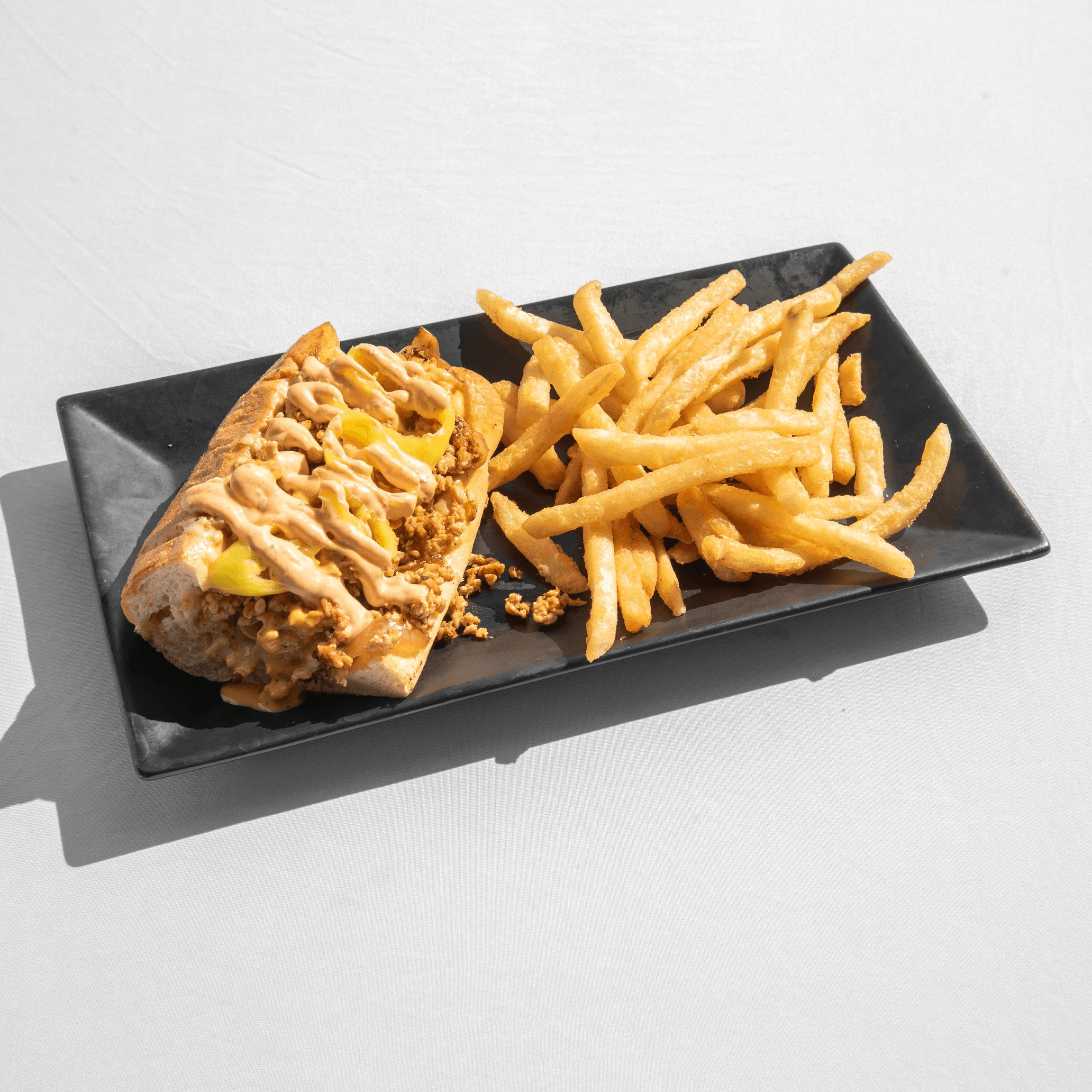 Buzzin Cheesesteak + Fries.