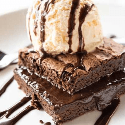 CHOCOLATE BROWNIE WITH ICE CREAM.