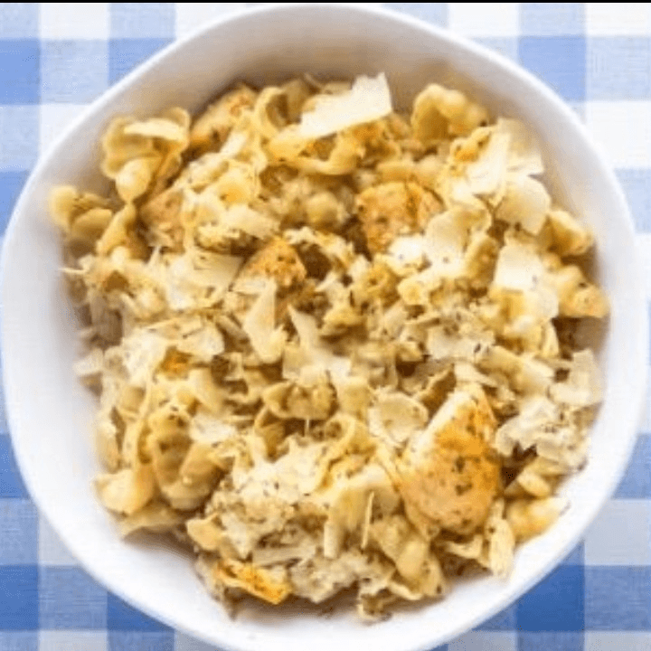 Dish of Fresh Pasta with a Side of Garlic Bread.