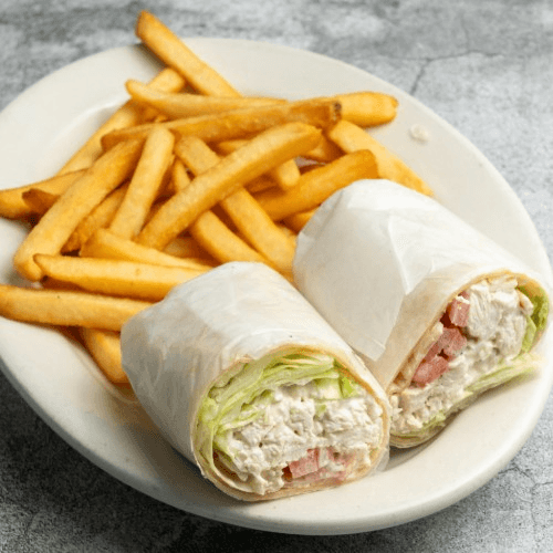 Chicken Salad Wrap Served with French Fries.