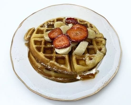 Belgian Waffles Topped with Bananas, Strawberries.