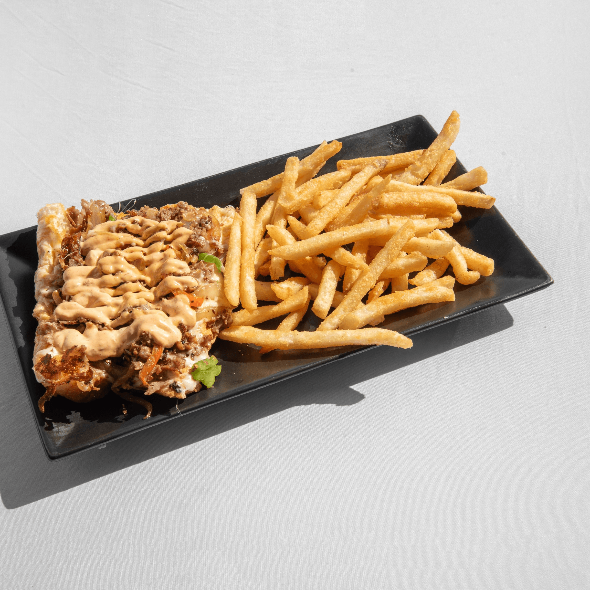 El Mexicano Cheesesteak + Fries.