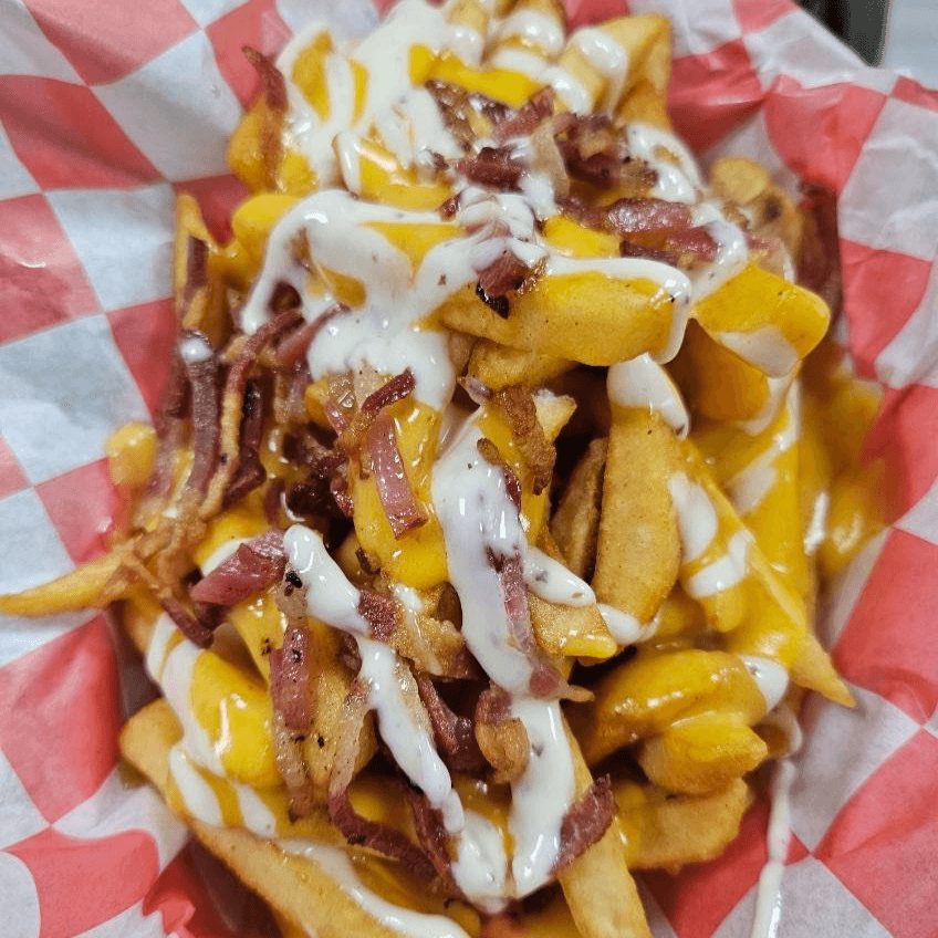 Palm Frenzy Fries with Palm Cheese Sauce, Ranch and Bacon.