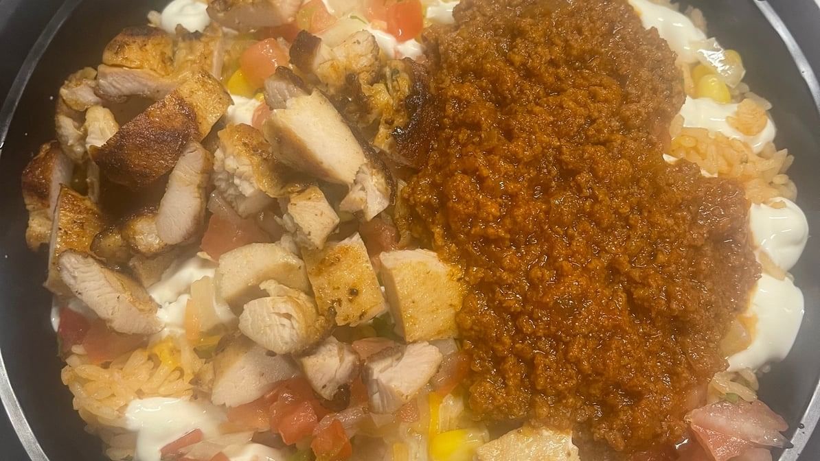 BUY ONE GET ONE Santa Fe Style Rice and Beans with Half Chicken and Half Ground Beef.