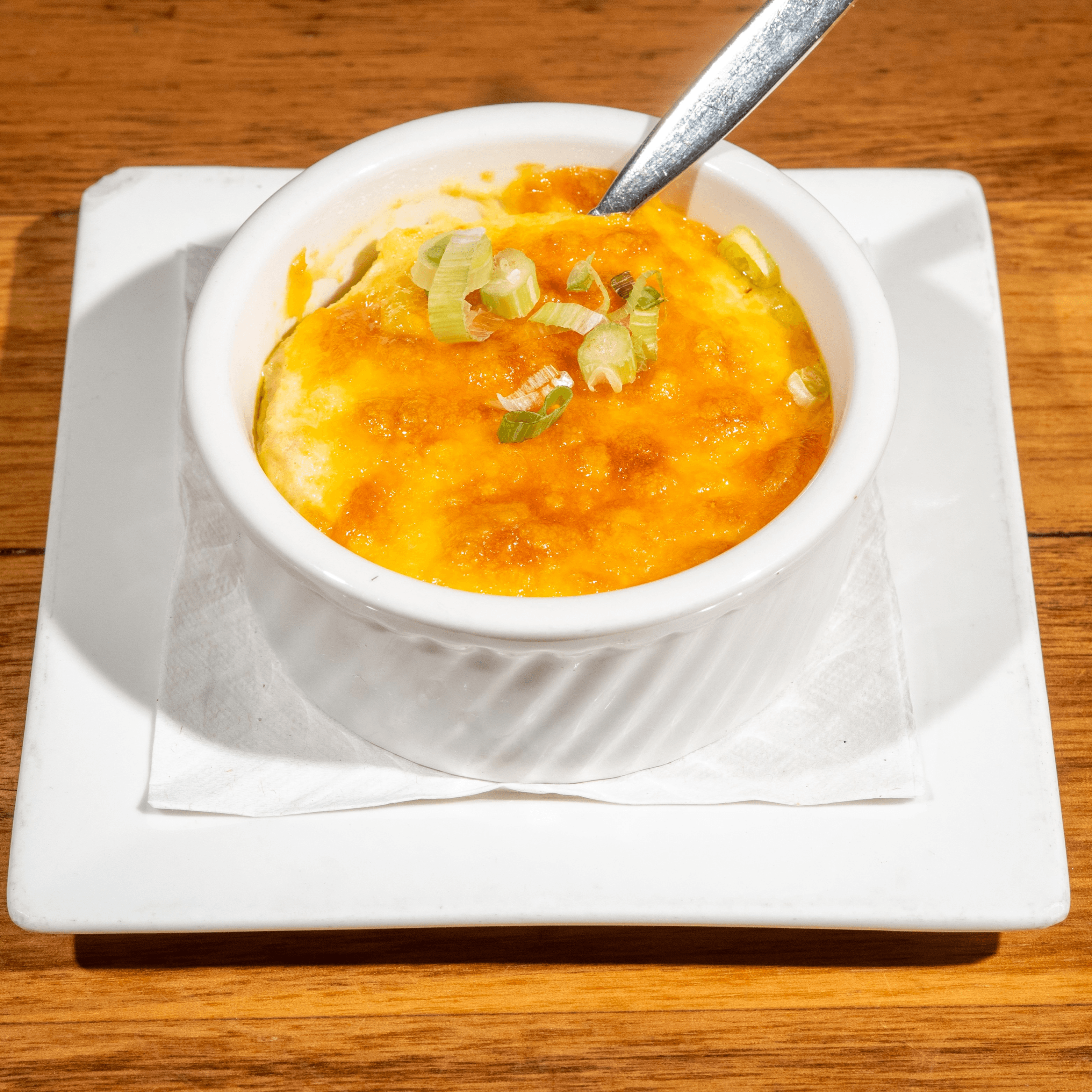 Seafood Cheddar Grits with Crab and Lobster Broth.