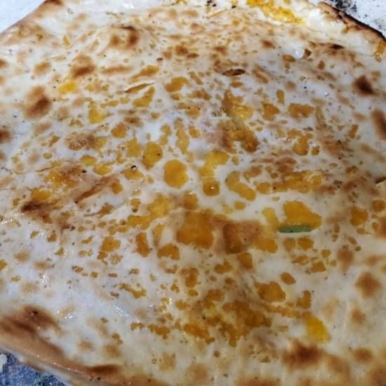 Vegan spicy cheese naan.