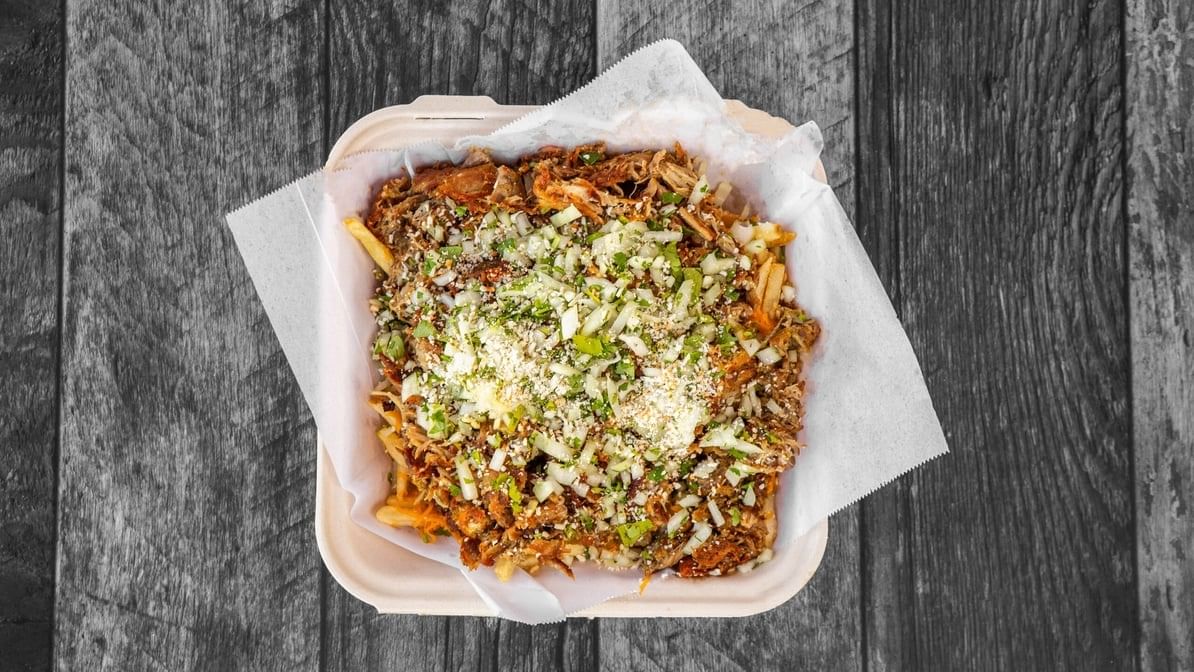 CHILE VERDE FRIES - FRIES, CHEDDAR, CARNITAS, SALSA VERDE, CILANTRO Y CEBOLLA, QUESO. NO SUBSTITUTIONS.