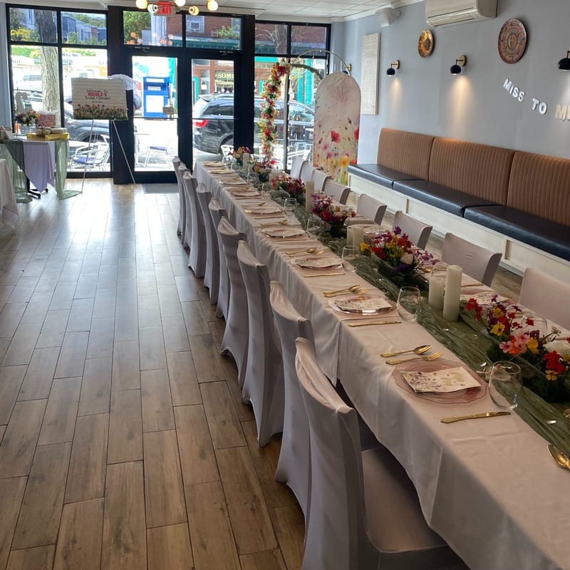 The long bridal shower table with the street through the windows
