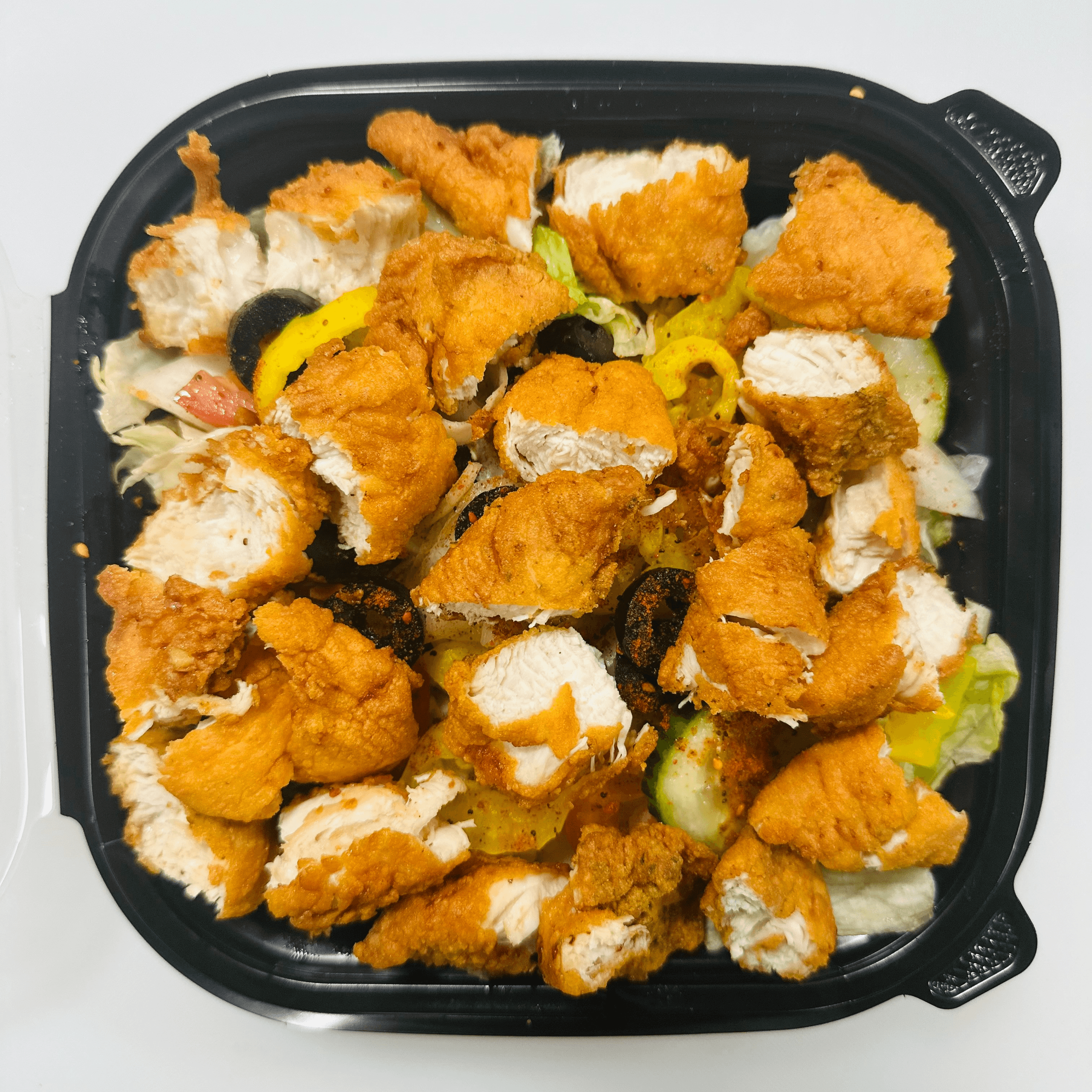 Fried chicken over rice.