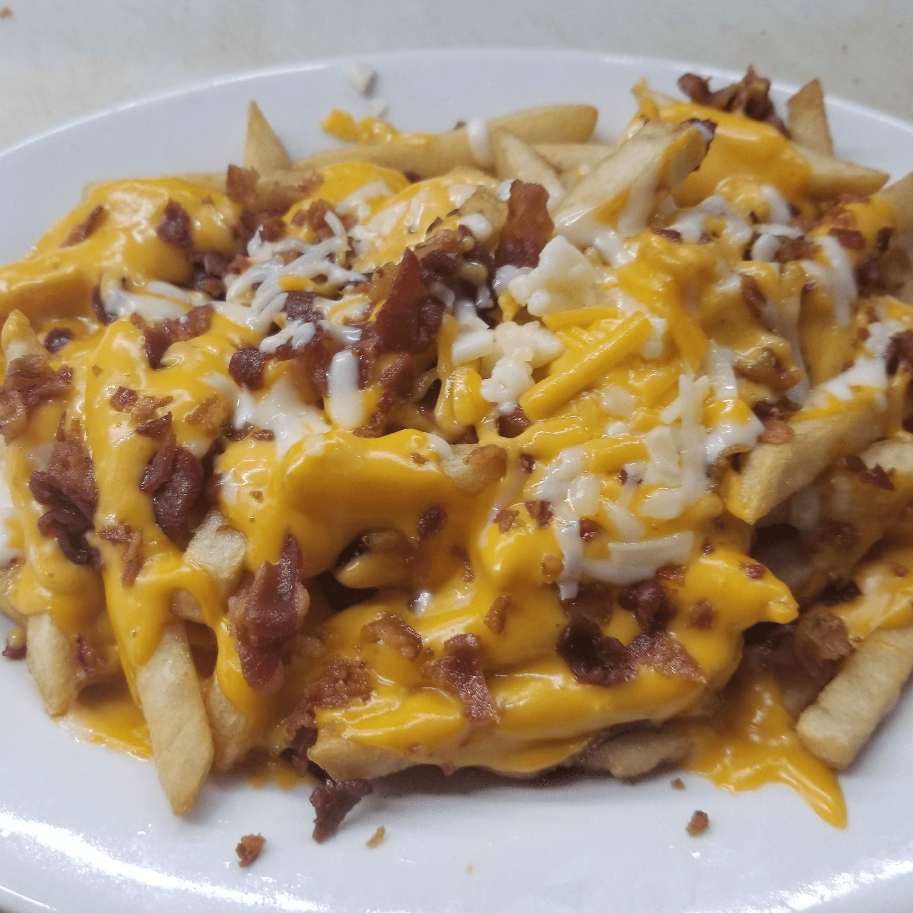 French Fries with Cheese & Bacon.