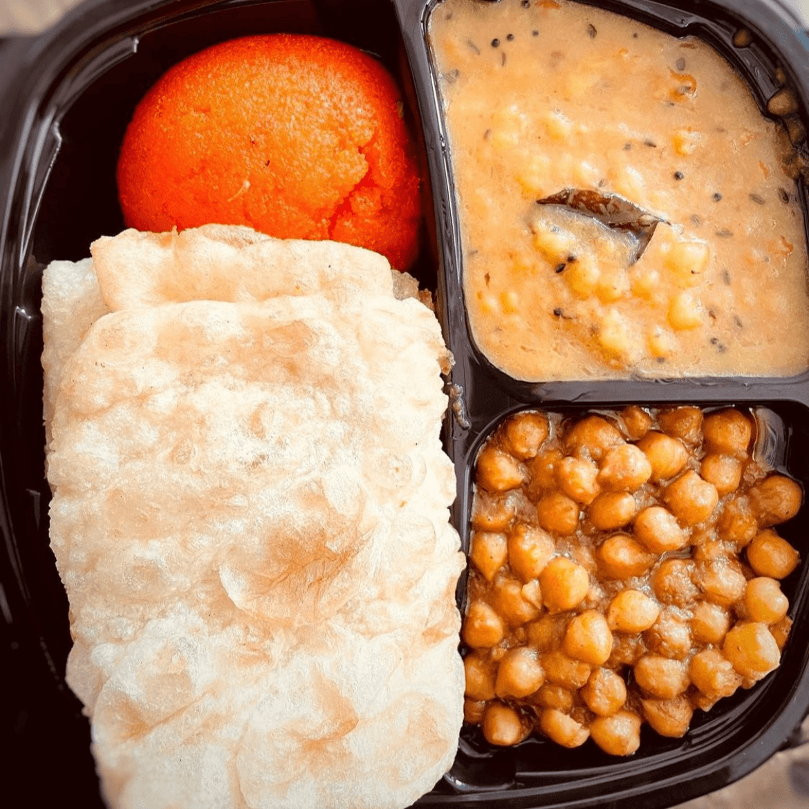 2 Puris, Halwa, Chana, & Aloo.