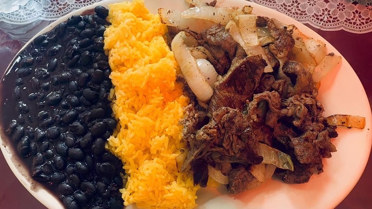 Bistec Entomatado / Steak Sautéed Tomatoes and Onions.