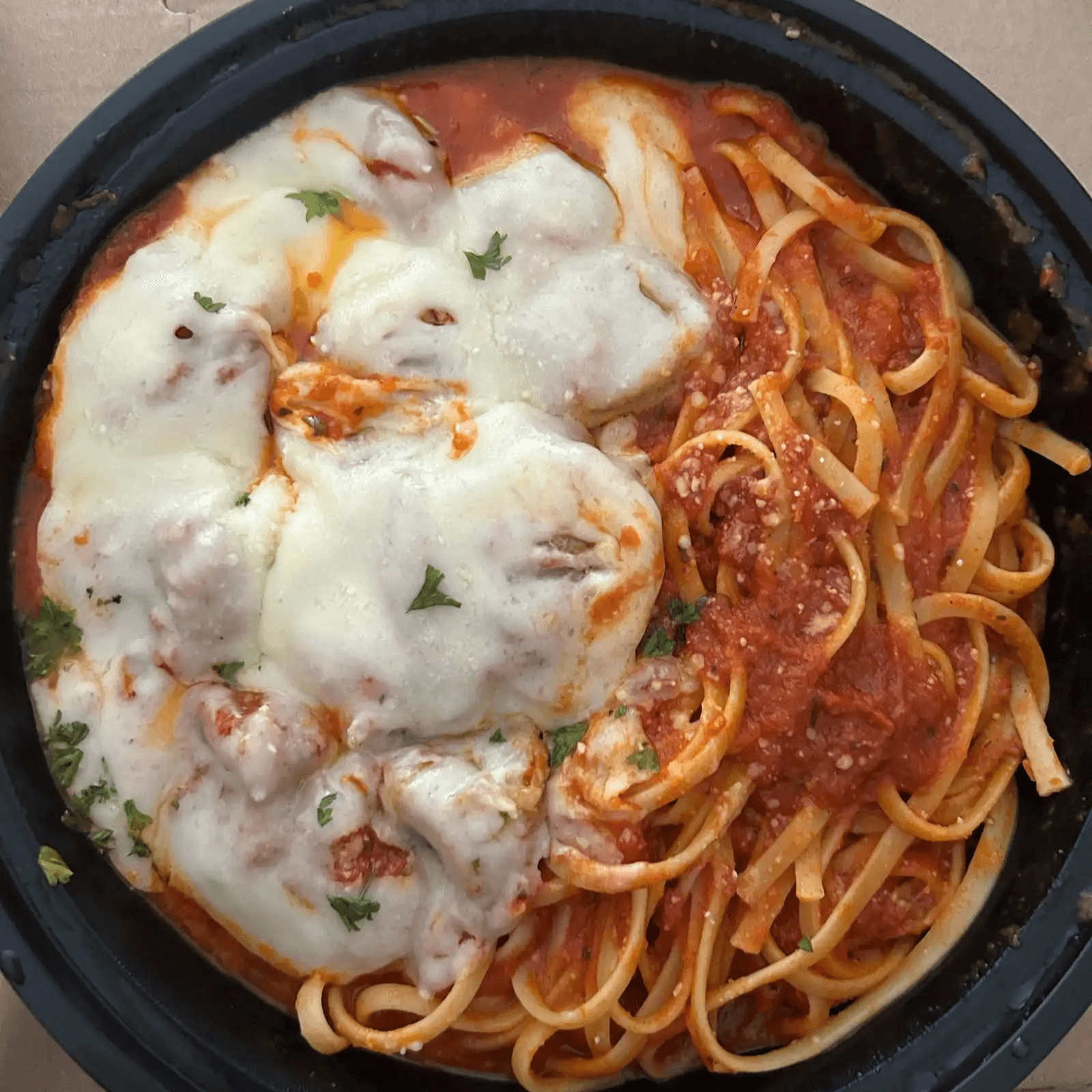 Meatballs & Sausage Parmigiana Dish.