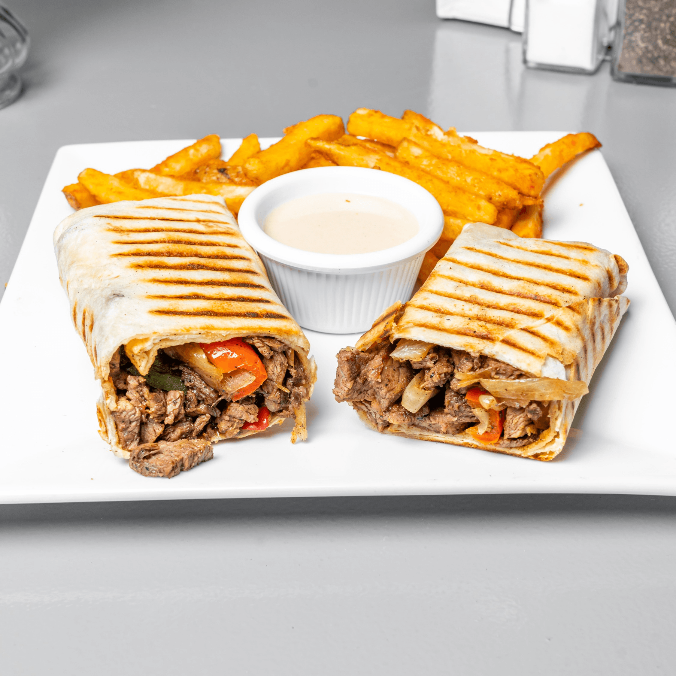 Beef Shawarma Sandwich with fries.