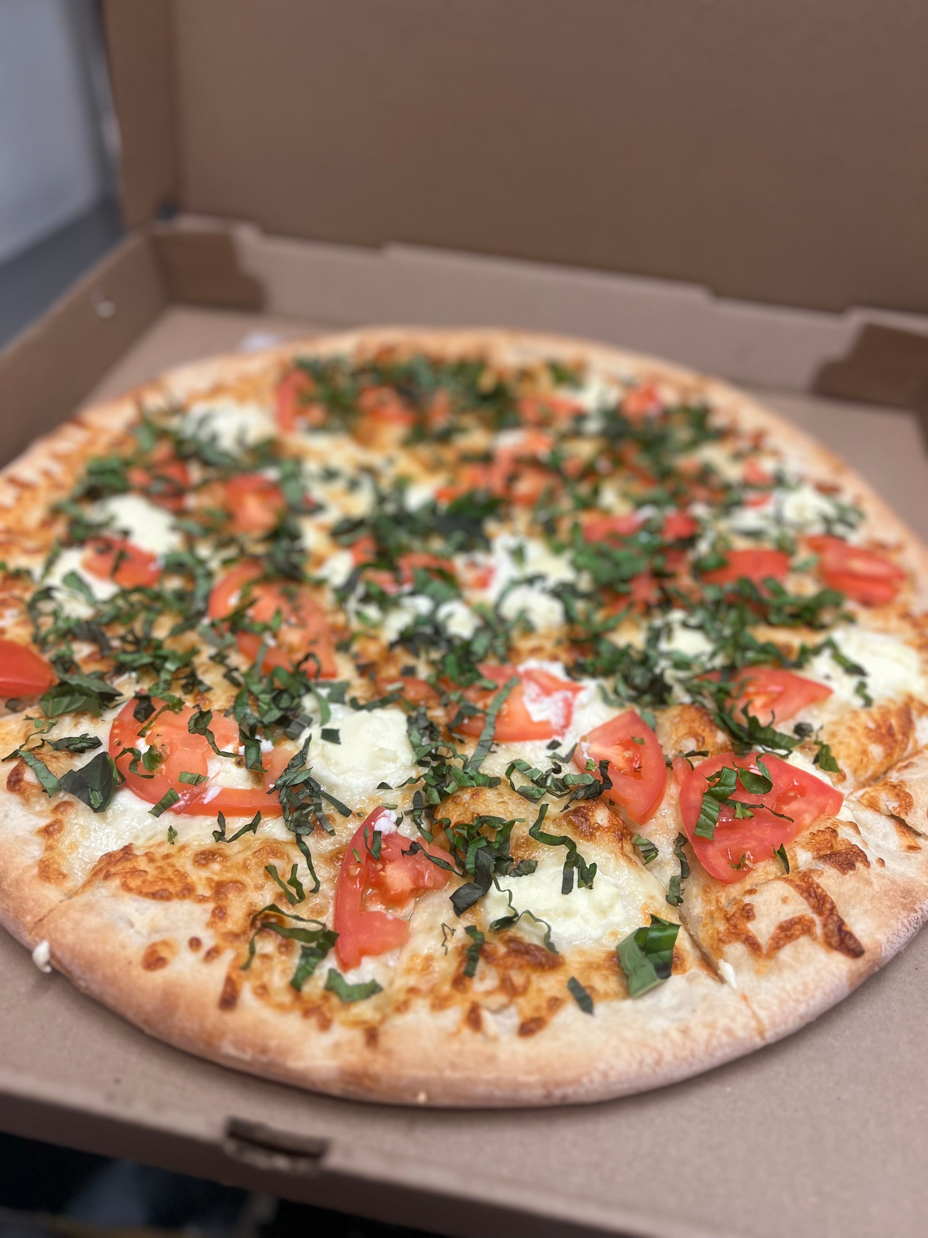 Tomato basil white pizza.