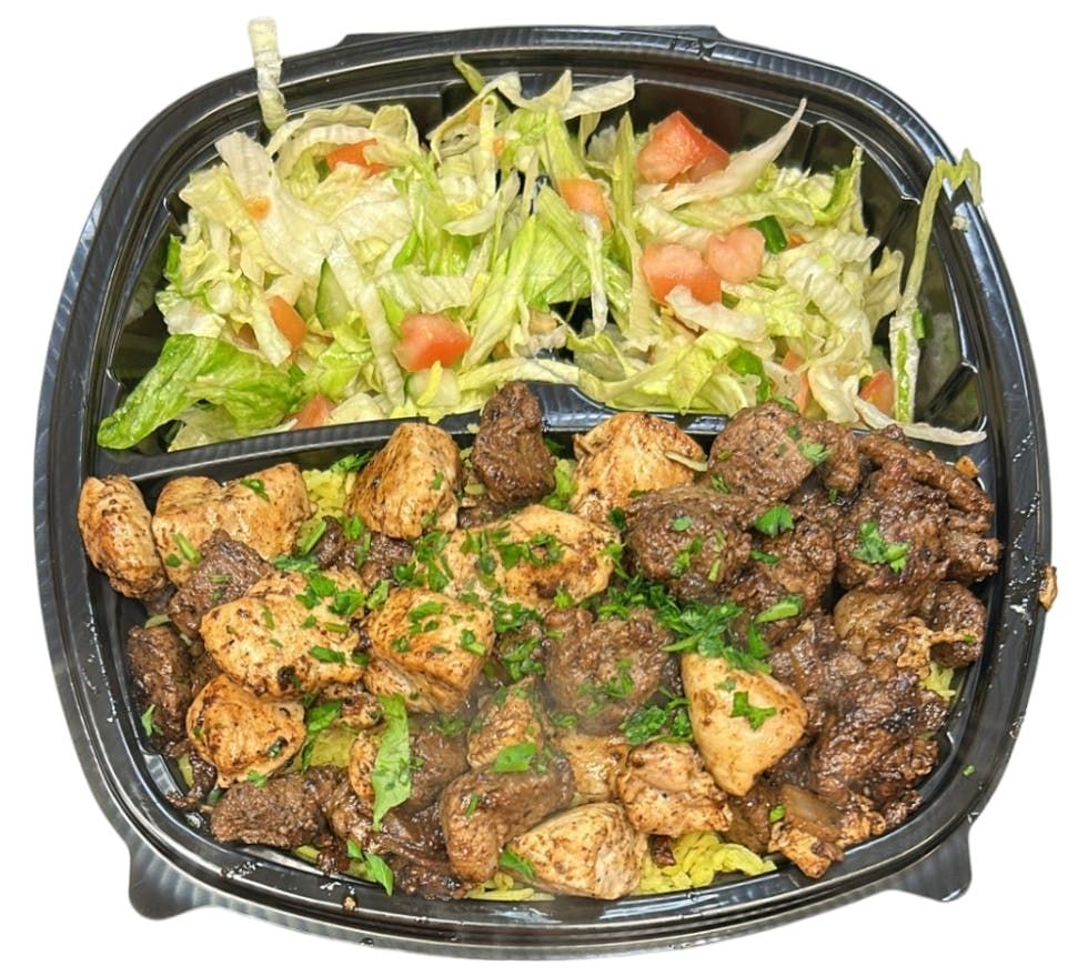Halal Grilled Lamb and Chicken on Rice with Salad and Soda.