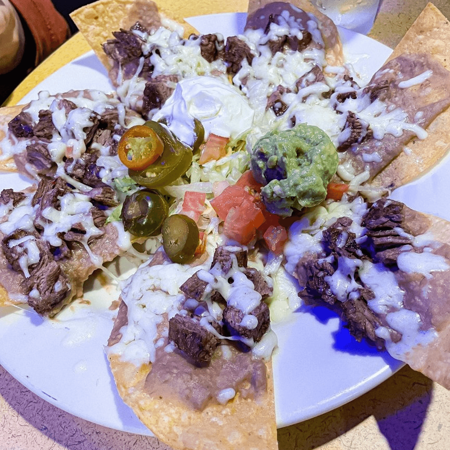 What sets Nachos Tejanos apart?