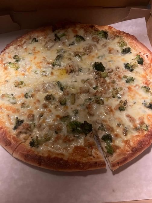 Sun's Alfredo Supreme Pizza.
