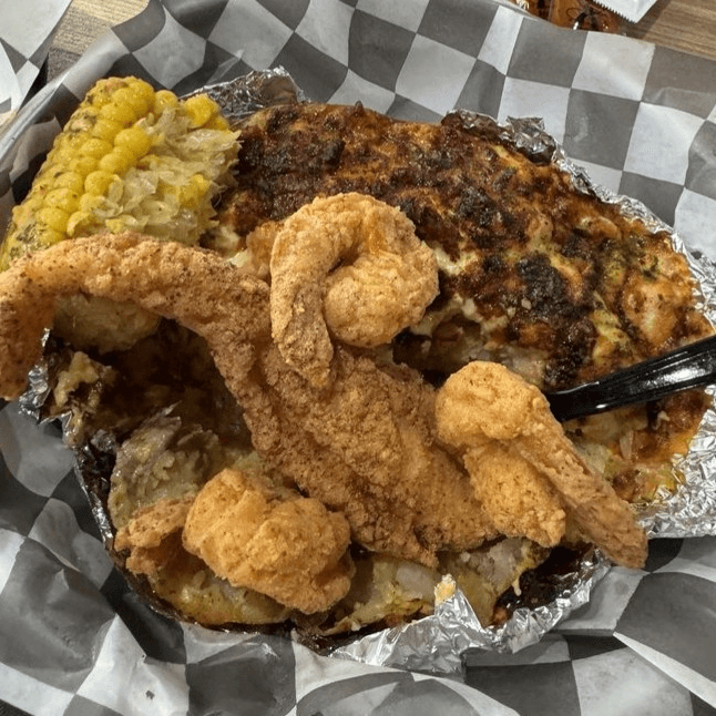 Seafood loaded baked potatoes.