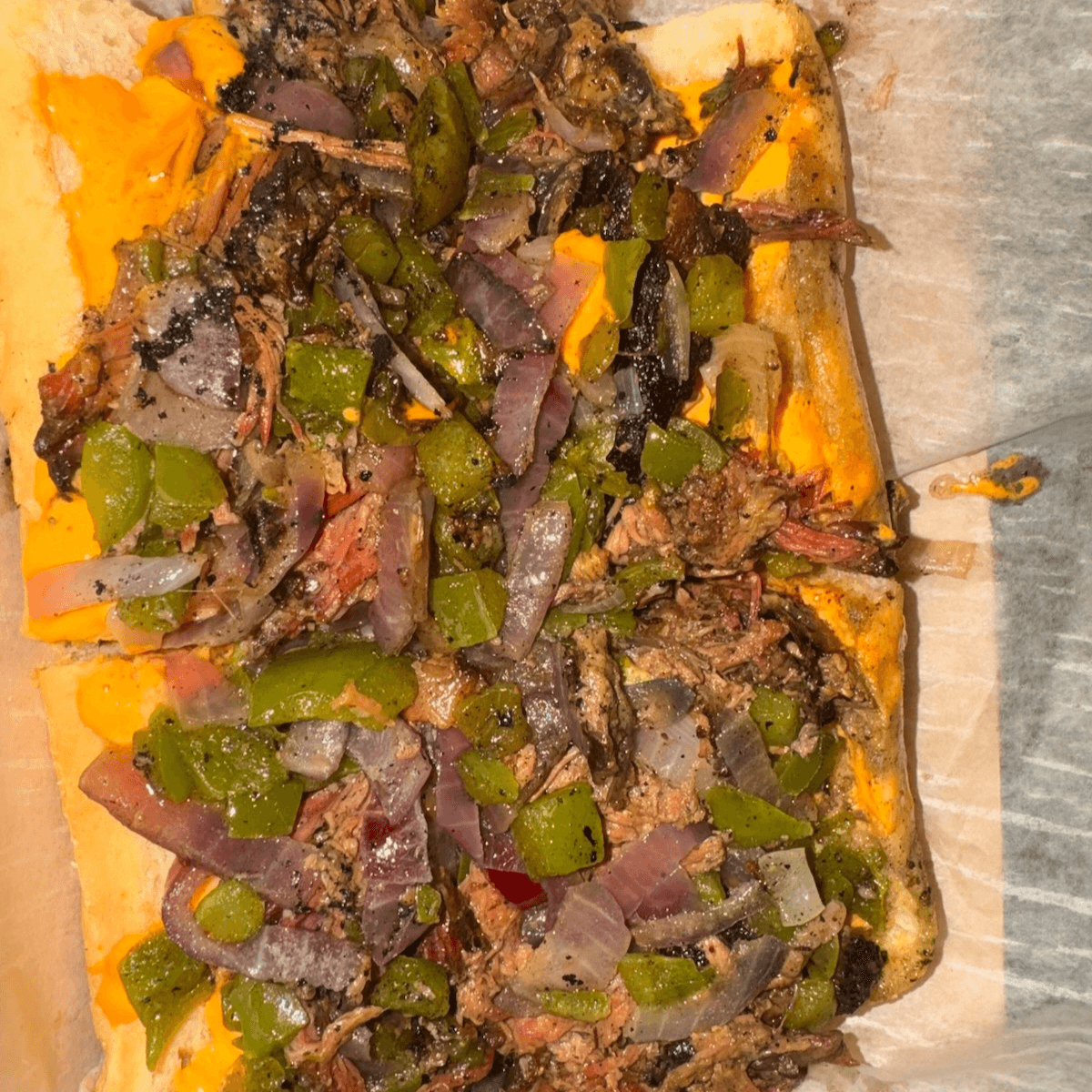 Smoked Angus Brisket Cheese Steak.