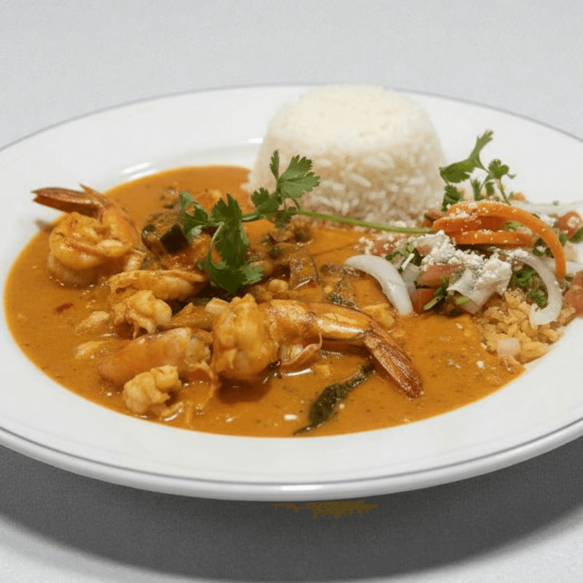 Camarones en Crema De Tequila.