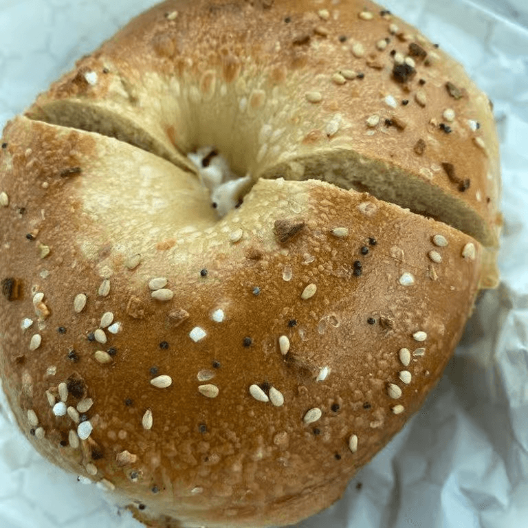 A bagel with scallion spread.