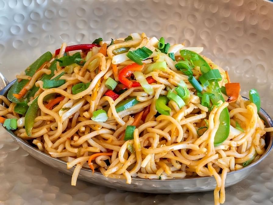 Schezwan Noodles With Veg Manchurian Balls (Online).