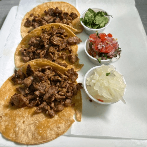 Tacos De Carne Asada or Chicken Y Carnitas.