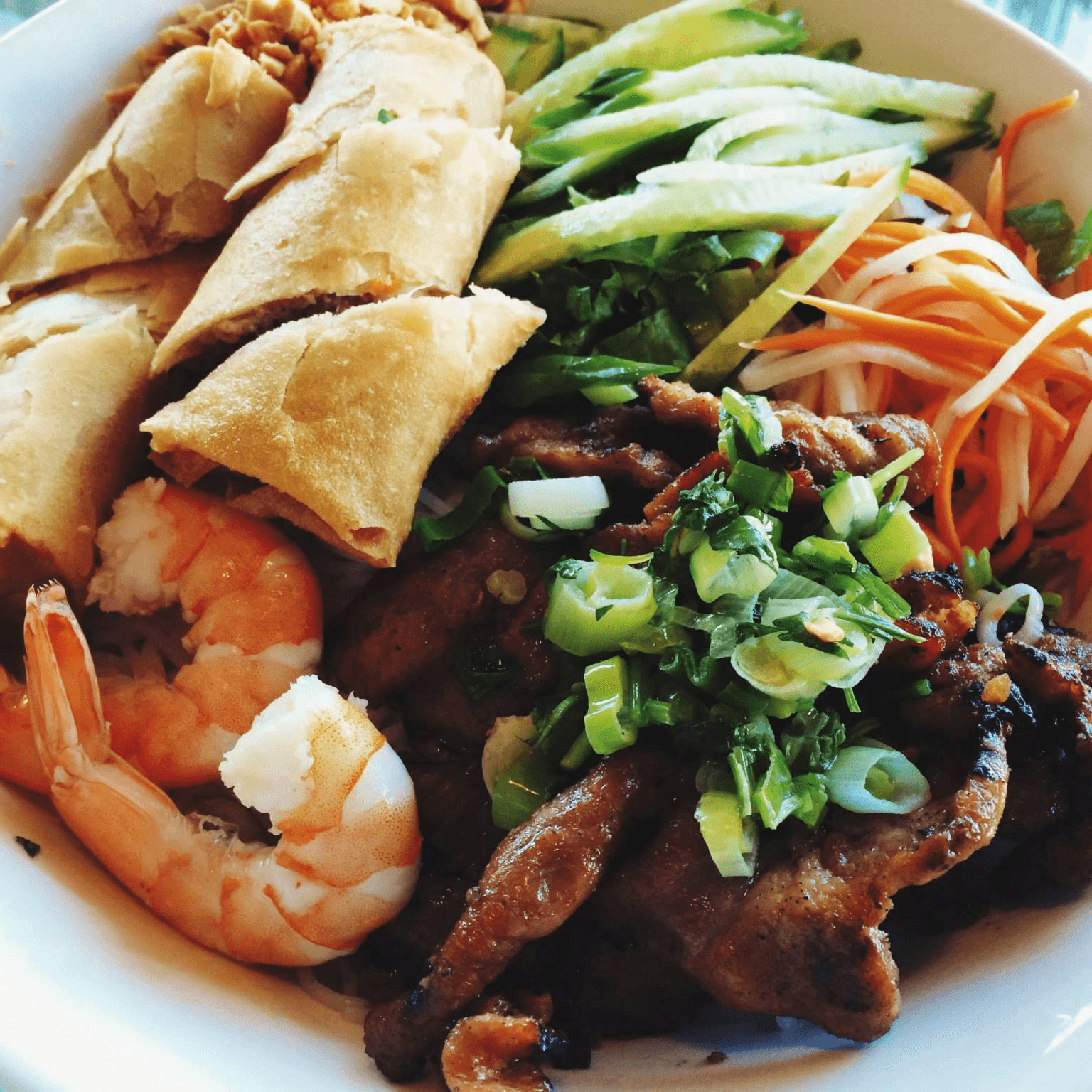 Vermicelli with bbq pork, shrimp, and egg rolls.