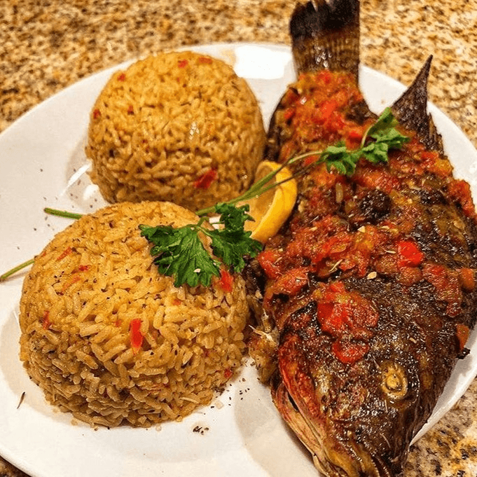 Grilled Tilapia with Nigerian Jollof rice.